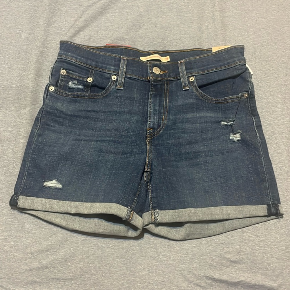 Women’s Levi’s Jean shorts mid rise mid length hyper soft slim. Size 28. NWT